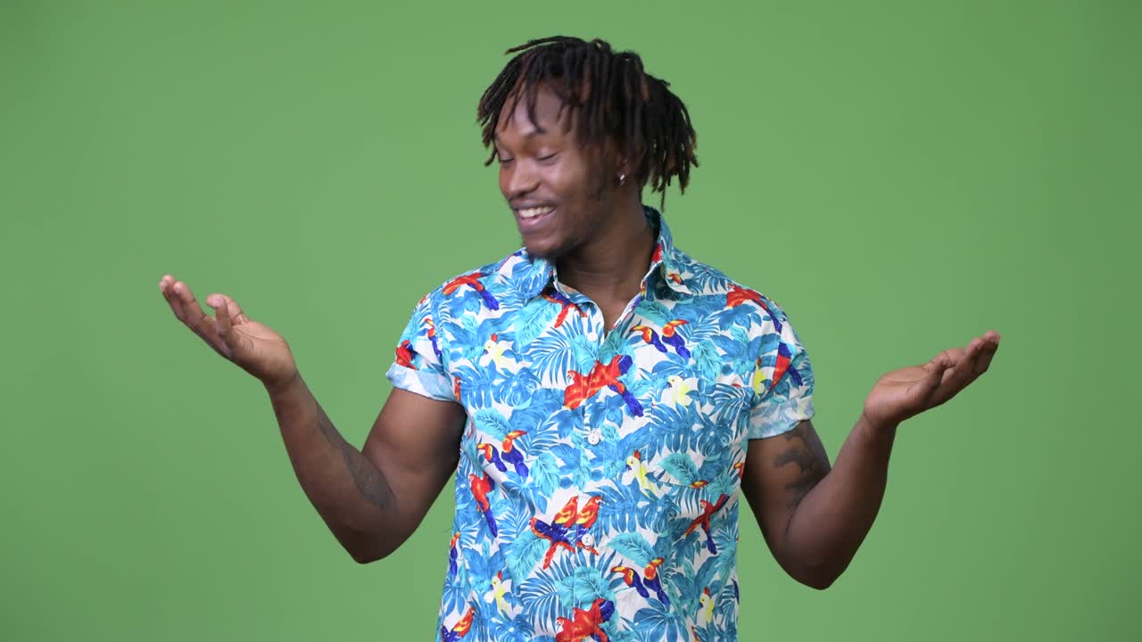 Young handsome African tourist man choosing between left and right