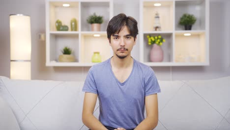 man looking at camera with dull expression.