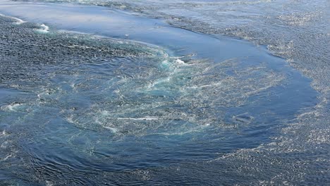 Blue-waves-of-water-of-the-river-and-the-sea-meet-each-other-during-high-tide-and-low-tide.