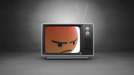 Digital-animation-of-angry-face-emoji-on-television-screen-against-grey-background