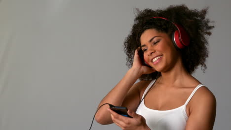 pretty girl with afro listening to music