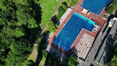 best aerial top view flight
public swimming pool insulaner, city berlin germany summer day 2023