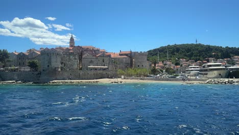 view of korcula town city harbour port from a boat in the adriatic sea in croatia