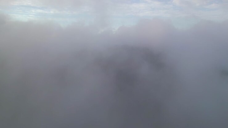 An aerial view over clouds in the morning on Storm King Mountain, located on the west bank of the Hudson River in NY
