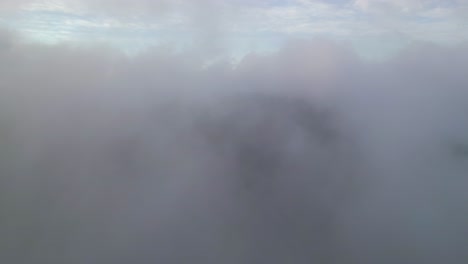 an aerial view over clouds in the morning on storm king mountain, located on the west bank of the hudson river in ny