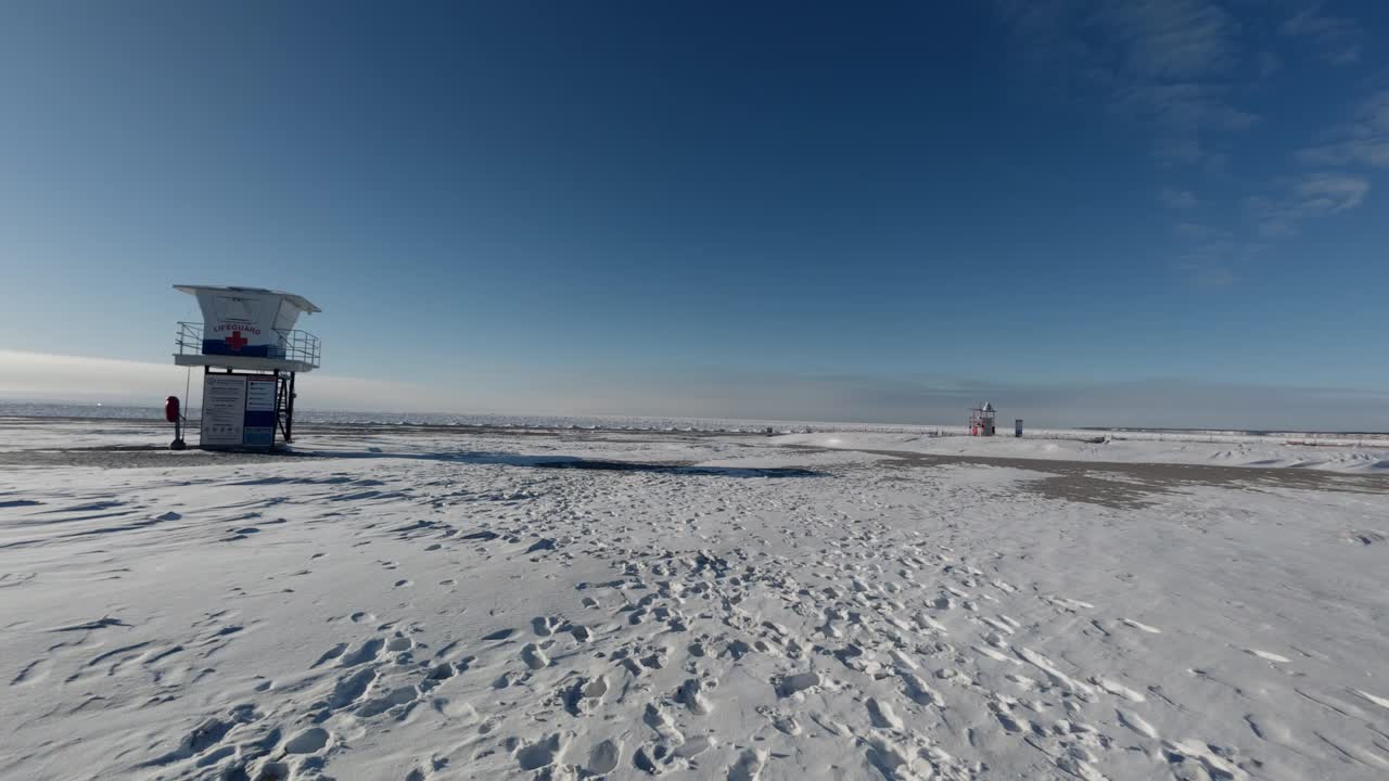 lifeguard stand on the beach frozen in winter