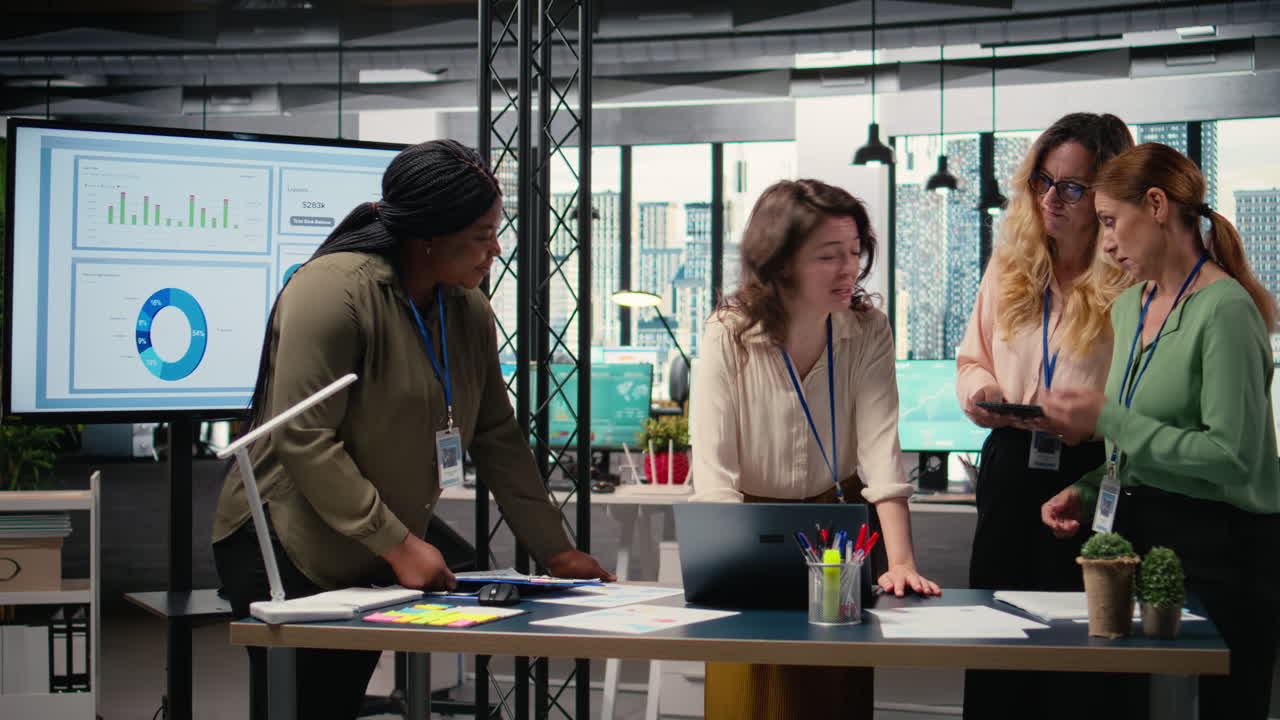 Vertical Video Group of businesswomen meeting in the office to align performance objectives