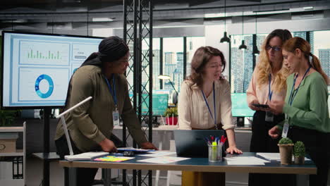 vertical video group of businesswomen meeting in the office to align performance objectives