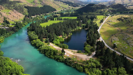 sunny day outside roxburgh, cinematic landscape, turquoise river and lake
