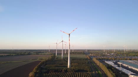 lovely aerial view flight raise up drone
of a wind turbine wheel field at brandenburg germany at summer day 2022