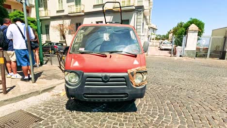 vehicles and pedestrians in a busy naples street