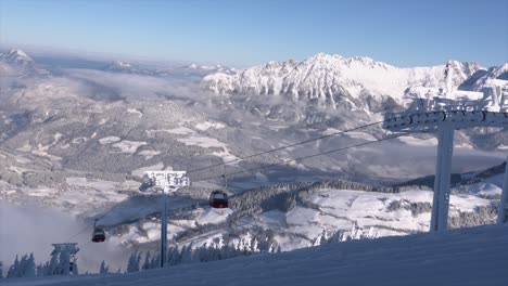 cable railway in tourism area in the alps, austria, nice weather in the morning, view into valley