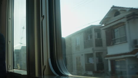 scenic journey through japan's lush countryside: a window view from the train