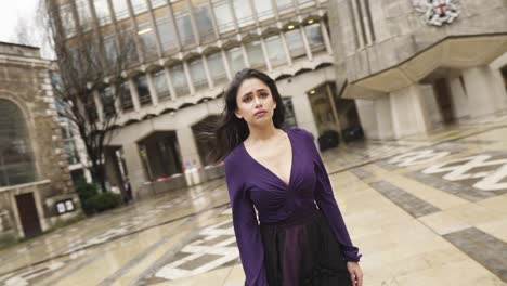 Young-Indian-woman-walking-alone-through-an-empty-locations-in-cloudy-weather-gothic-style-moody-slowmotion