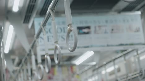 White-Handrails-On-A-Train-In-Tokyo,-Japan