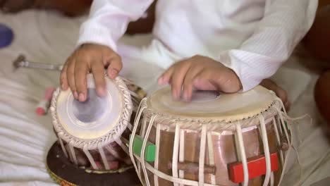 playing tabla drums