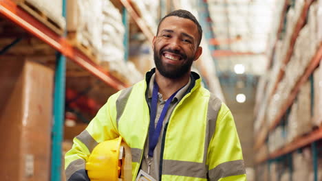 warehouse worker smiling in a warehouse