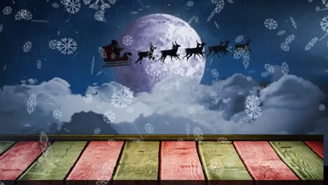 Animation-of-snowflakes-falling-over-santa-claus-in-sleigh-pulled-by-reindeers-against-night-sky