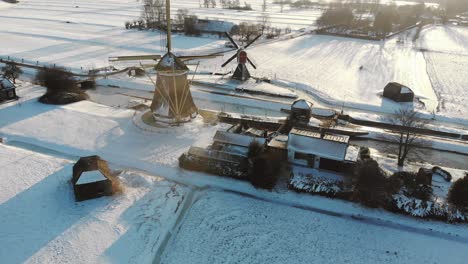 Droneshot-of-a-typical-Dutch-landscape-with-traditional-windmills