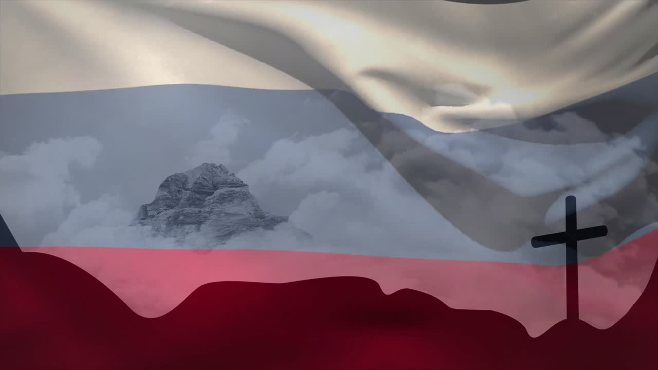 Vid start vajar en vit-blå-röd flagga över berget och avslöjar en korssilhuett som skapar en loop