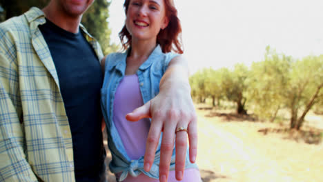 Portrait-of-happy-couple-showing-engagement-ring-4k