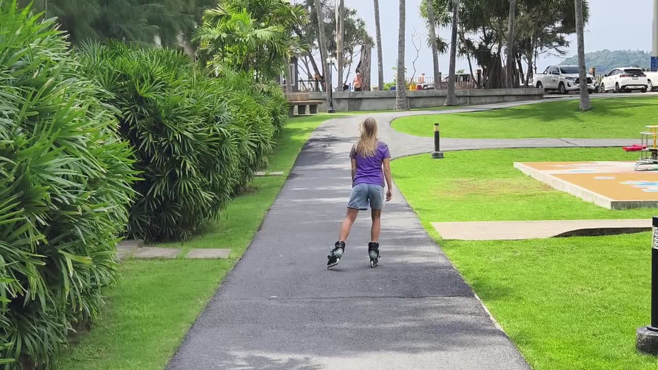 Woman Rollerblading in a Tropical Park