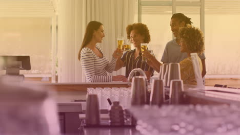 animation of beer icons over happy diverse friends talking and drinking beer