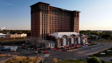 rising drone footage of michigan central station in detroit during sunset