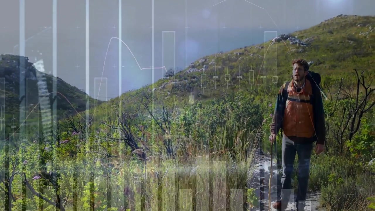 Male hiker descending trail carrying backpack and generating route overlay for outdoor navigation