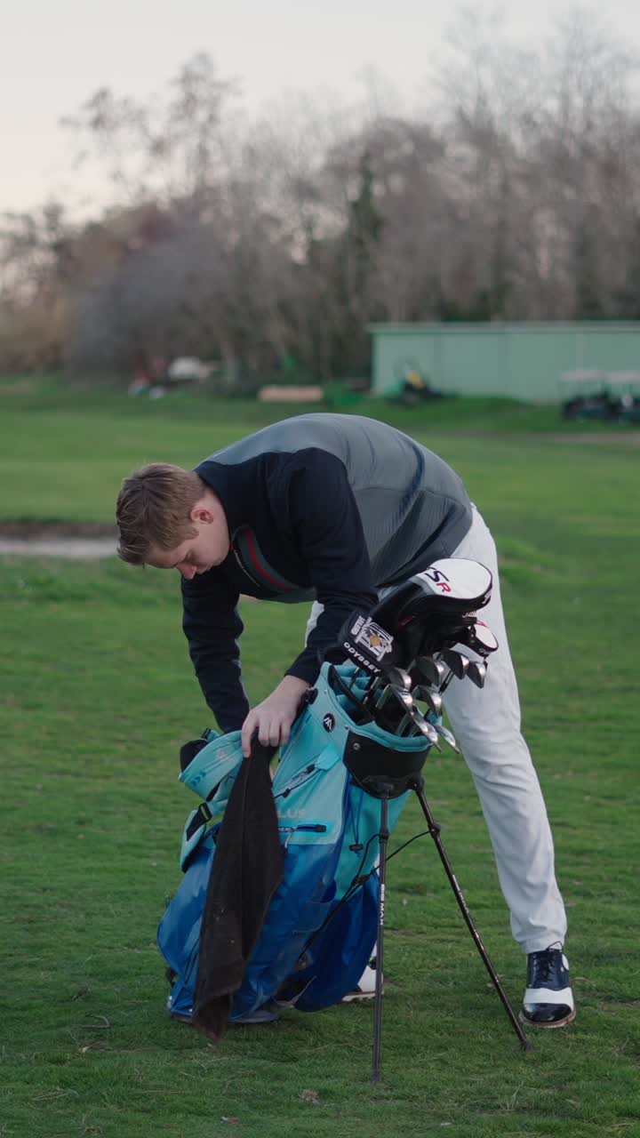 Golfer with golf bag on a golf course