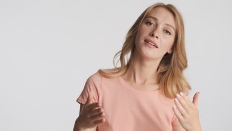 Caucasian-woman-waving-hands-on-camera.