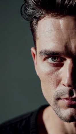 close-up portrait of a man with dramatic shadowing