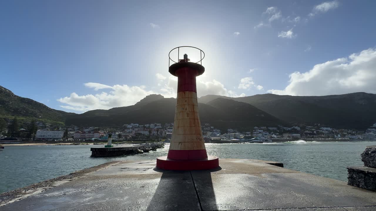 A light house on the harbour pier wall of Kalk Bay, near Cape Town in South Africa.