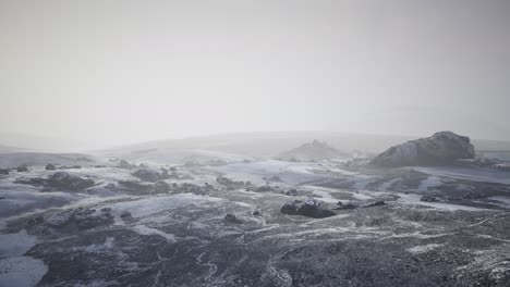 antarctic mountains with snow in fog