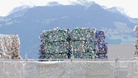 massive square stacks of plastic bottles for recycle, static view