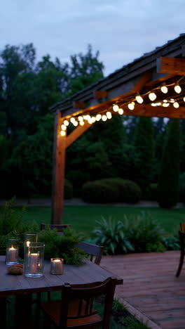 outdoor dining area under pergola at night