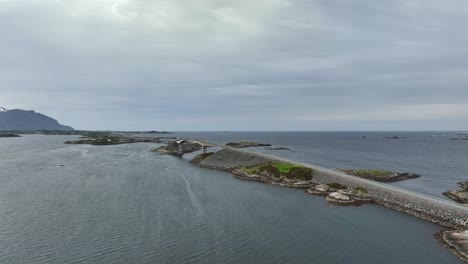 distant panoramic aerial presenting full atlantic ocean road view with the horizon in background - norway aerial view