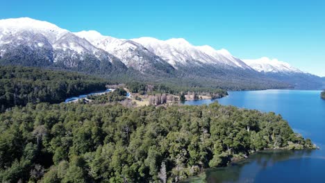 snowy mountains and endless lake in argentina, aerial view