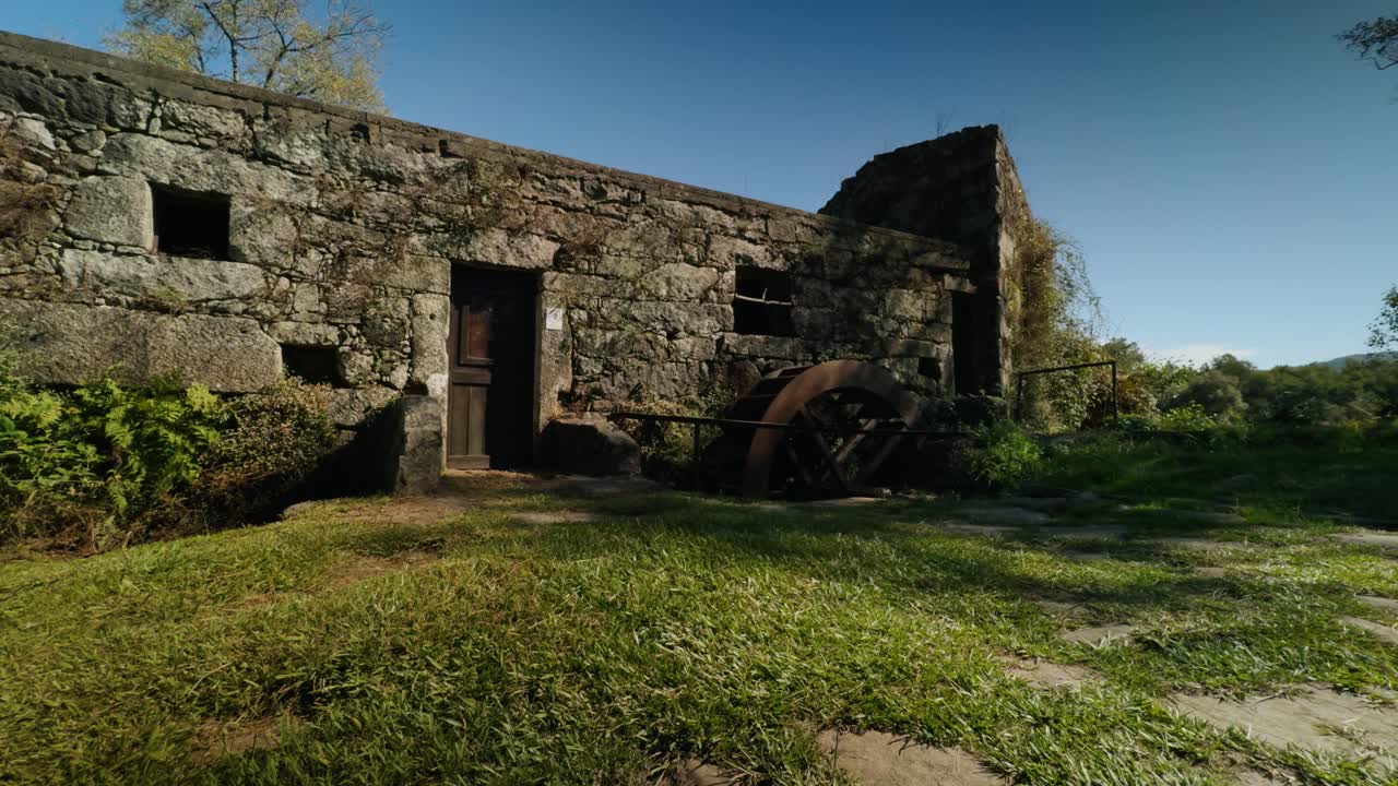 Old watermill on the shore of the Cavado river in north Portugal