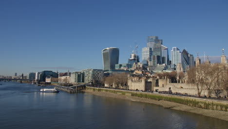 city of london skyline from tower bridge in london, uk