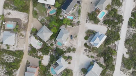 Drone-hovering-above-condos-in-Cape-San-Blas,-Florida