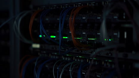 server racks with blinking lights and network cables in a data center