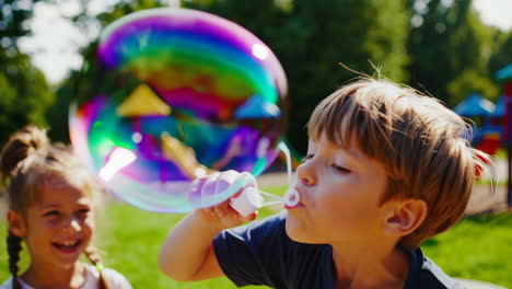 children blowing bubbles in a sunny park