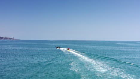 people enjoying water sports on a sunny day