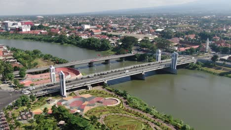 Modern-Brawijaya-bridge-over-Brantas-river-in-Kediri,-Java,-Indonesia,-aerial