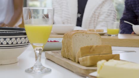 kitchen island surface with orange juice bread and butter