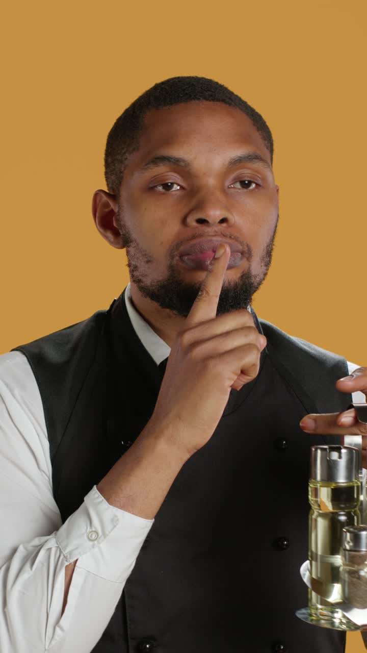African American Chef Making Shush Gesture with Finger on Lips