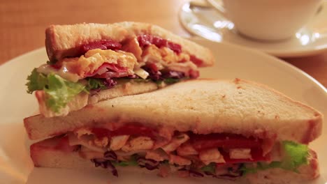 Delicious-clubhouse-sandwich-served-at-a-cafe-in-slow-motion