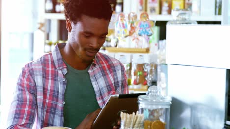 man using digital tablet