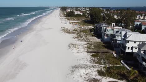 drone shot lifting off over a florida island and beaches